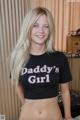 A woman in a black shirt that says Daddy's Girl.